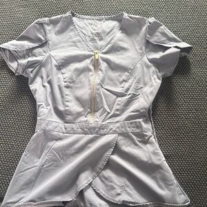 Peplum scrub top